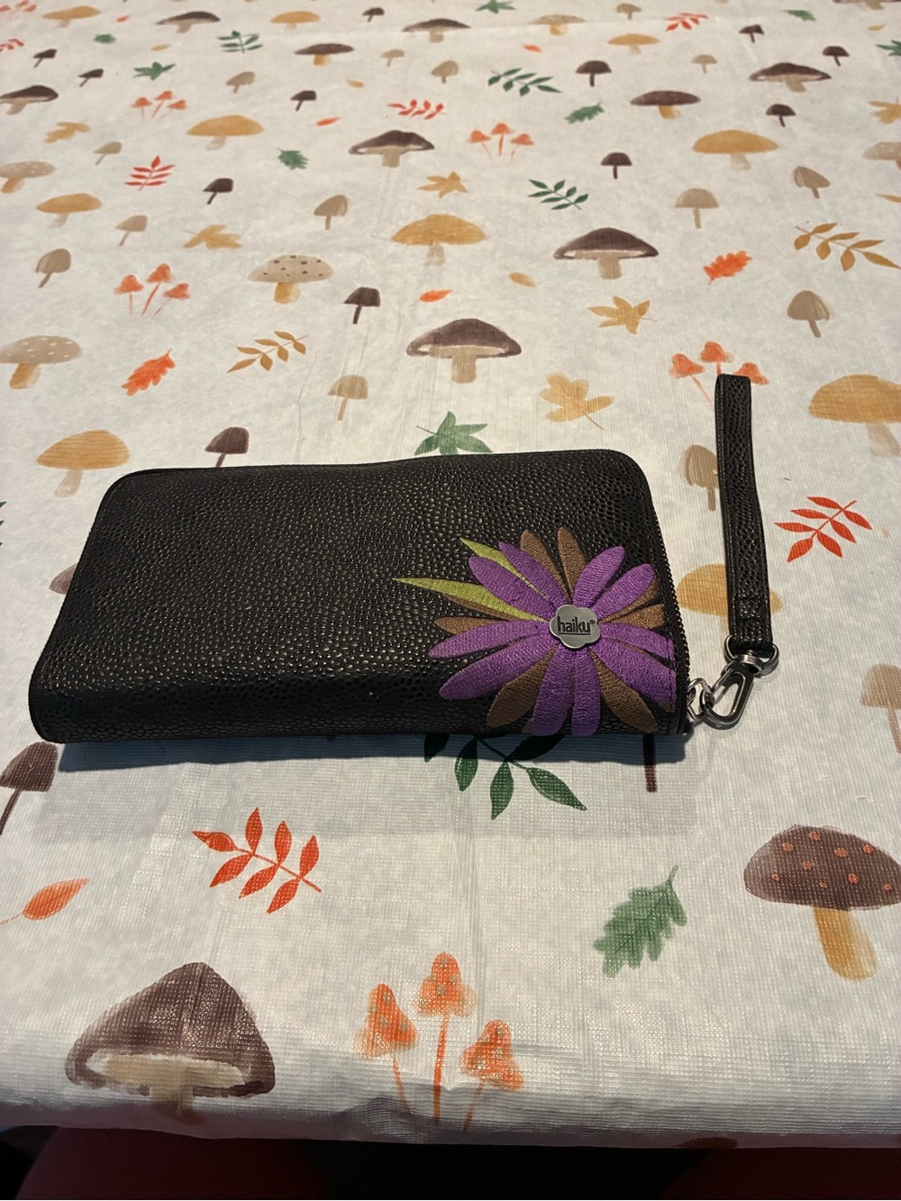 Haiku Black Wristlet Wallet with Purple Floral Accent